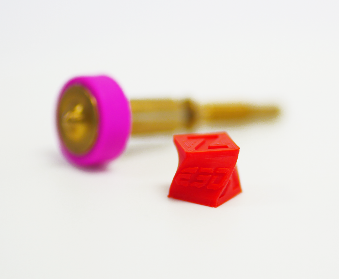 Tiny print next to a nozzle